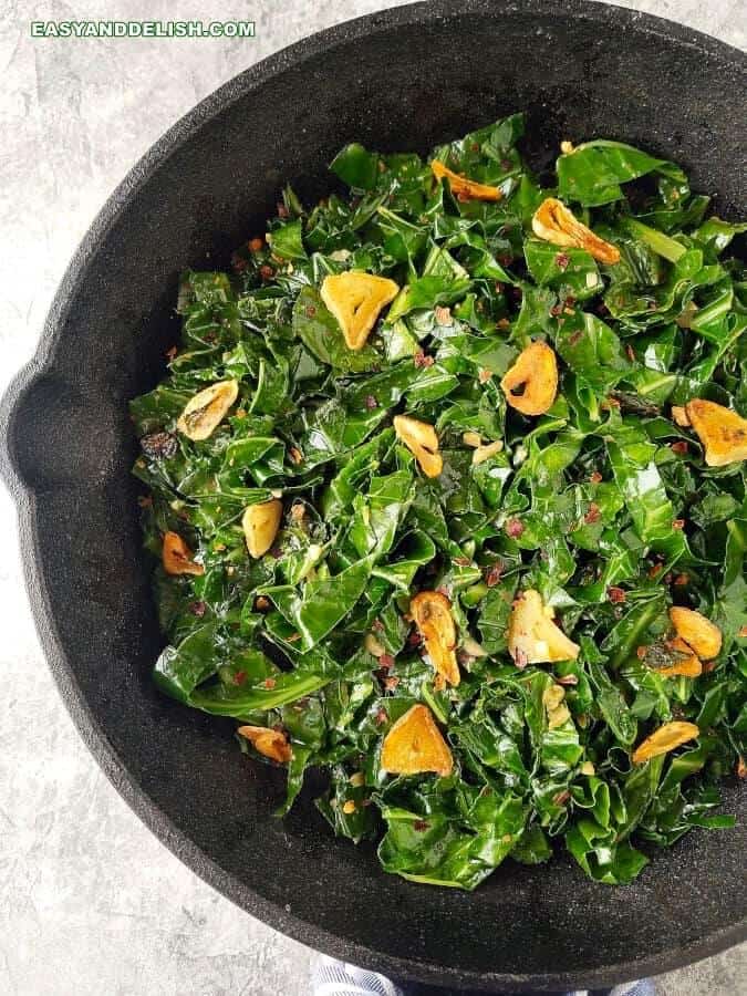 Close up of fried collard greens in a skillet