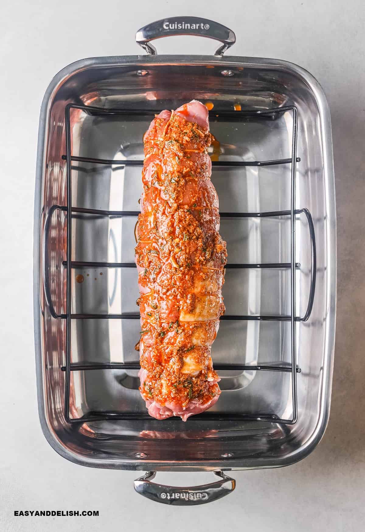 garlic paste over the loin in a roasting pan with a rack.