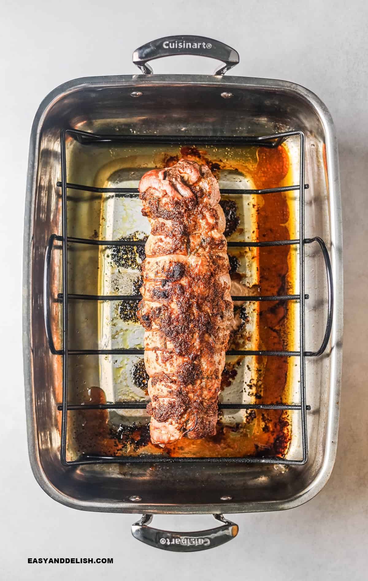 baked pork tenderloin in a roasting pan.