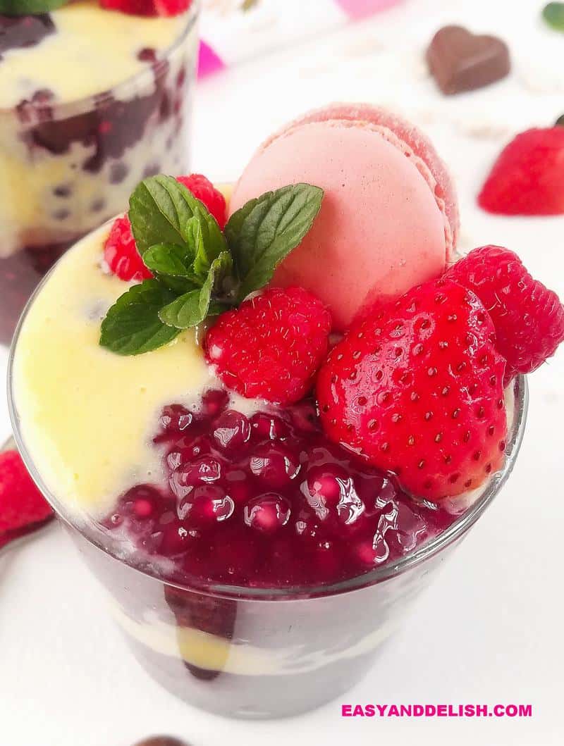 close up of dessert in a glass with berries