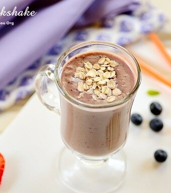 acai milkshake in a clear coffee cup