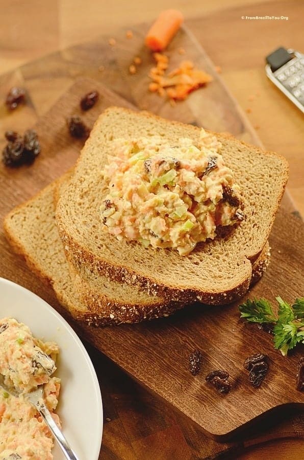 Placing filling on top of bread slices. 