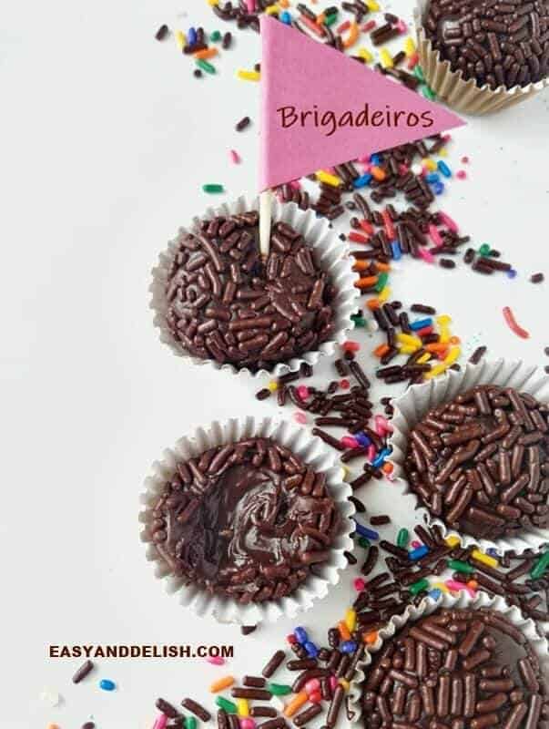 Brigadeiro candies on a table with a little flag on top