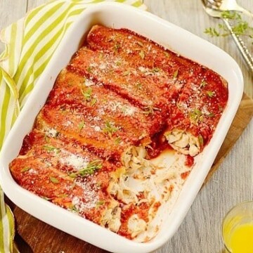 chicken panquecas or Brazilian chicken enchiladas in a white casserole dish