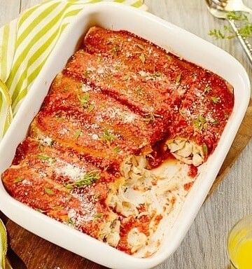 chicken panquecas or Brazilian chicken enchiladas in a white casserole dish