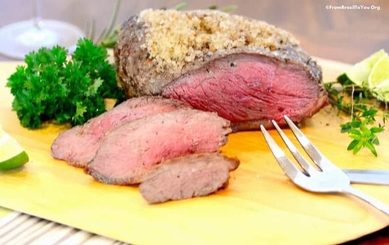 slices of picanha coated in coarse sea salt on a cutting board