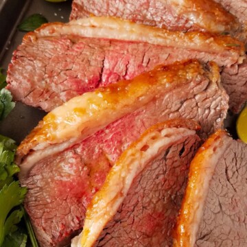 sliced picanha roast in a baking pan