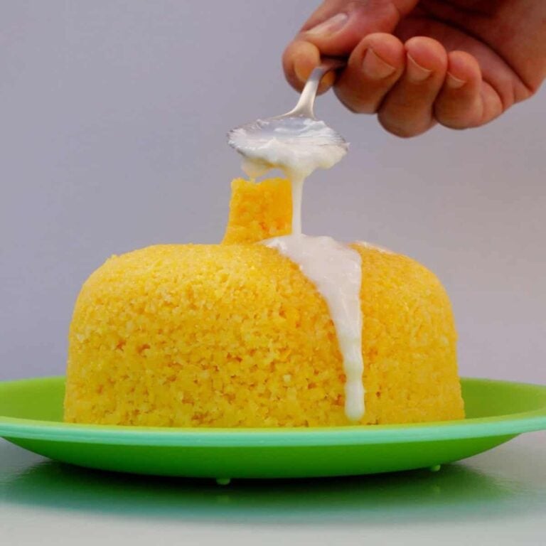 A mixture of condensed milk and coconut milk poured over Brazilian cuscuz de milho.
