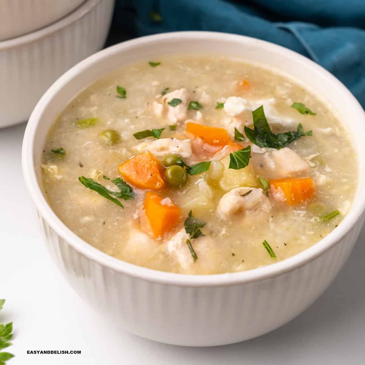 close up of a bowl of chicken and rice soup (canja de galinha)