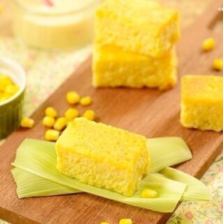 squares of yellow corn cake on a board