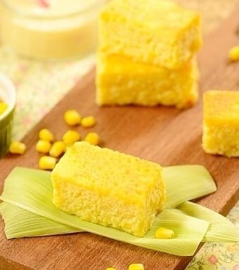 squares of yellow corn cake on a board