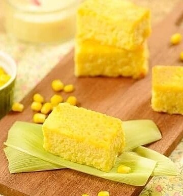 squares of yellow corn cake on a board