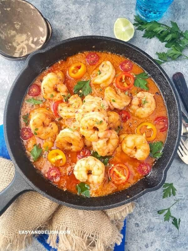 Moqueca baiana shrimp stew or seafood stew in a cast iron skillet 