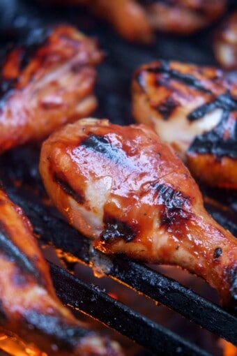 grilled chicken legs on a charcoal grill
