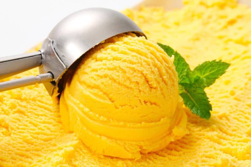 a scoop of mango ice cream