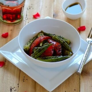 A bowl of okra salad on a table