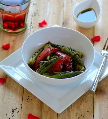 A bowl of okra salad on a table