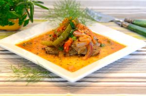 A plate of Beef Stew with a fork on the side