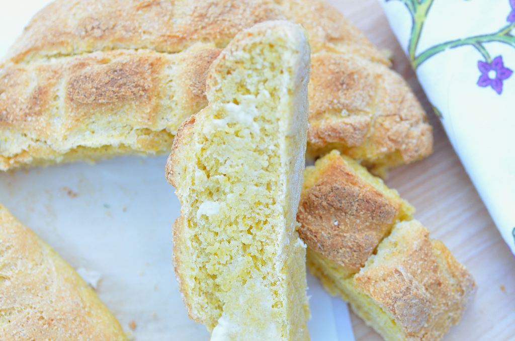 Wedges of bread and butter on a plate