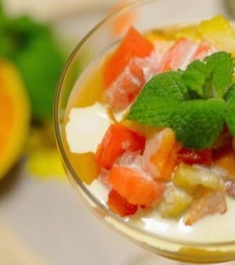 A bowl of fruit on a plate