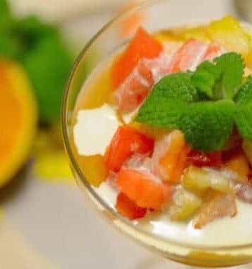 A bowl of fruit on a plate