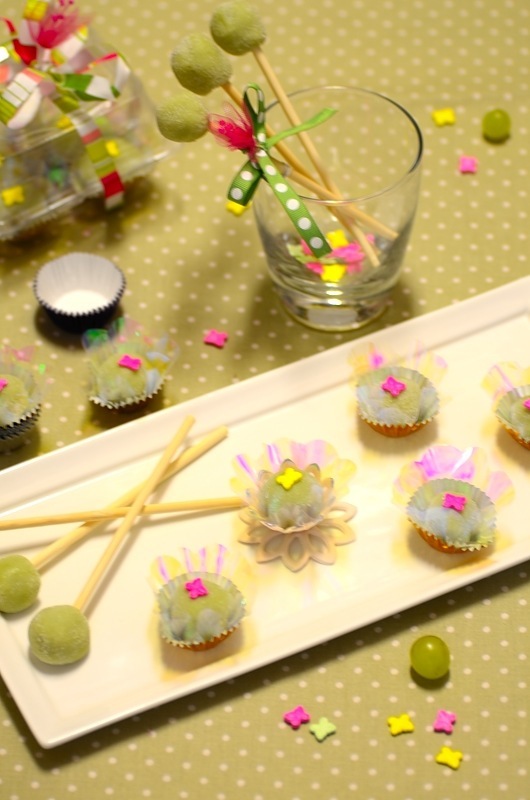a platter with uvinhas or grape fudge balls/candies and decorations on the sides