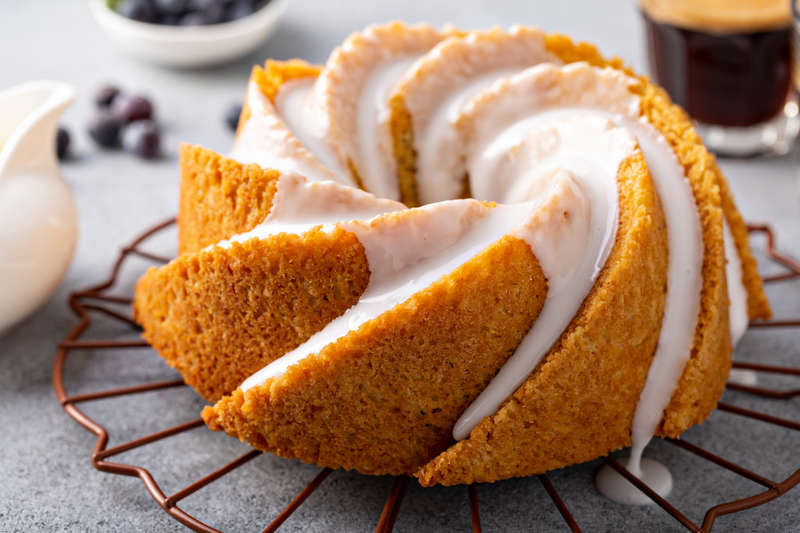 glazed passion fruit cake on a rack