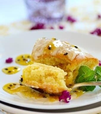 A forkful of passionfruit cake on a plate