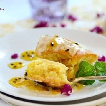 A forkful of passionfruit cake on a plate