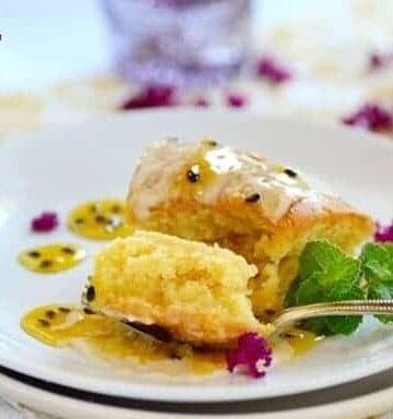 A forkful of passionfruit cake on a plate