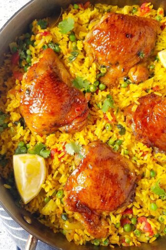 close up of galinhada mineira (Brazilian saffron rice with chicken) in a pan