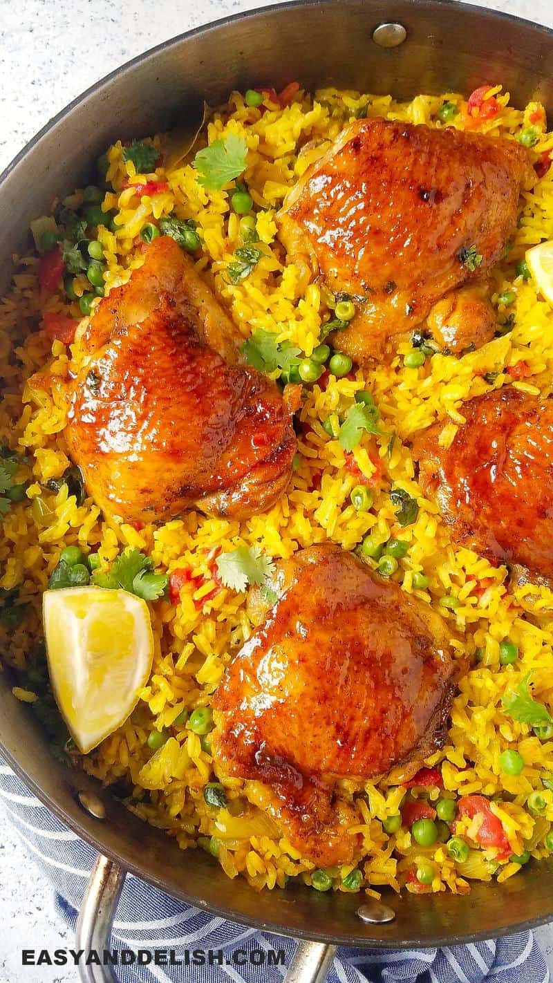 close up of galinhada (Brazilian chicken and rice) in a pan as our of our easy rice recipes