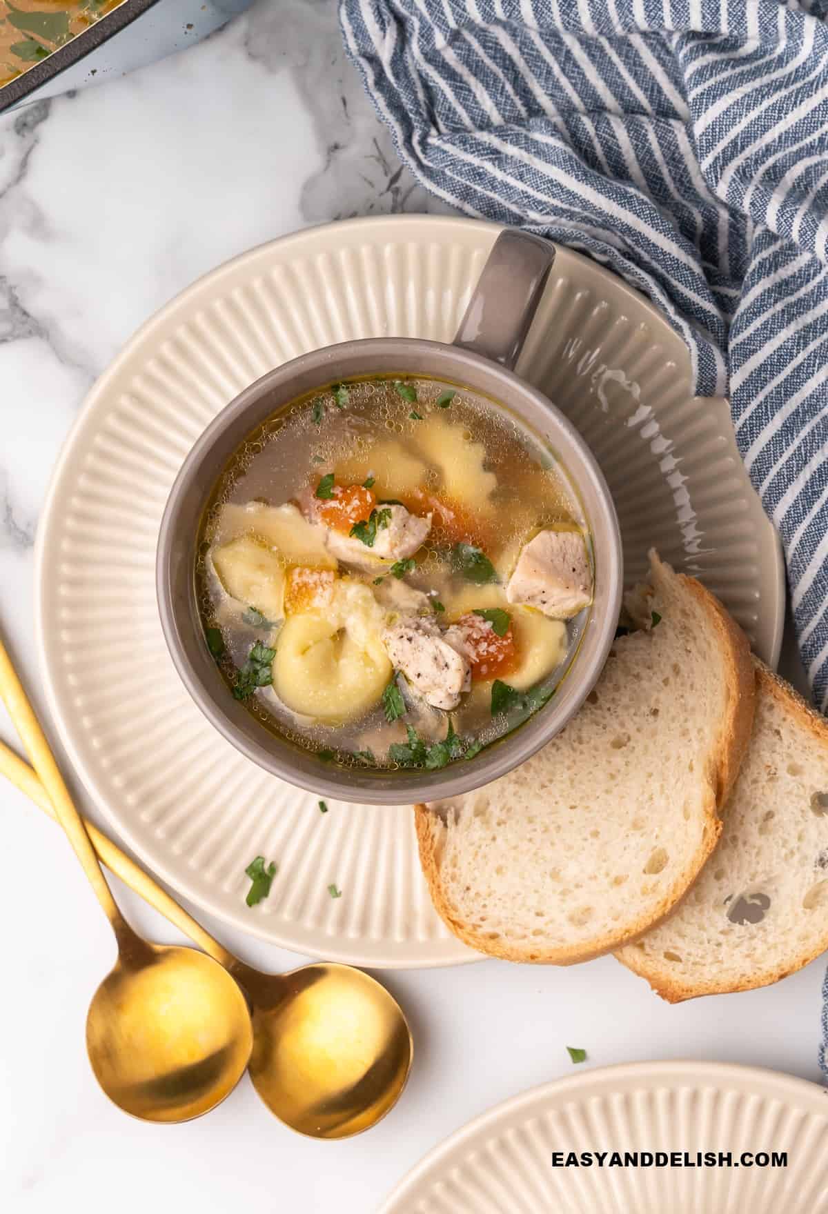 hot meal served with bread slices and spoon on the side