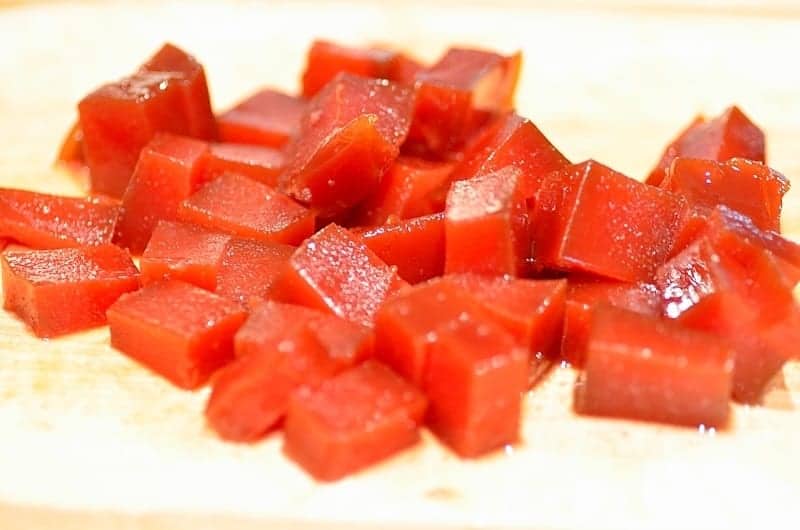 chunks of guava paste over a cutting board