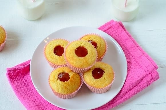 corn muffins with guava paste in a plate with milk on the side
