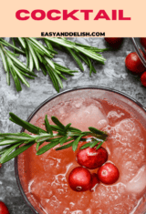 close up image pin of a glass of vodka cranberry cocktail.