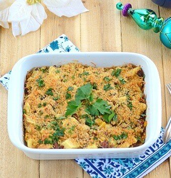 A breakfast casserole sitting on top of a wooden table