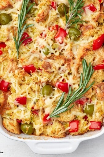 close up of savory bread pudding in a baking dish.