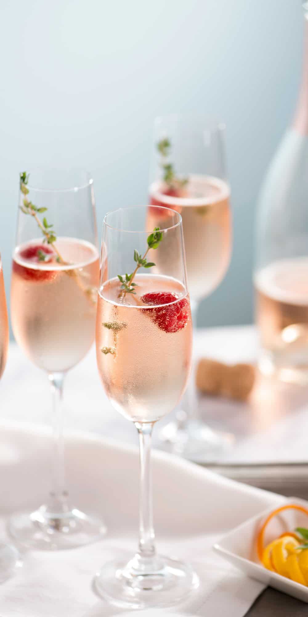 Several flute glasses with champagne vodka cocktail. 