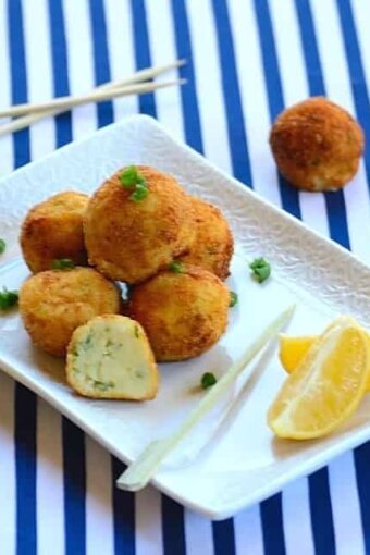 A plate of cod cakes with garnishes