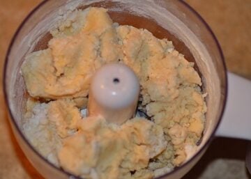 flour and other ingredients for dough mixing in a food processor