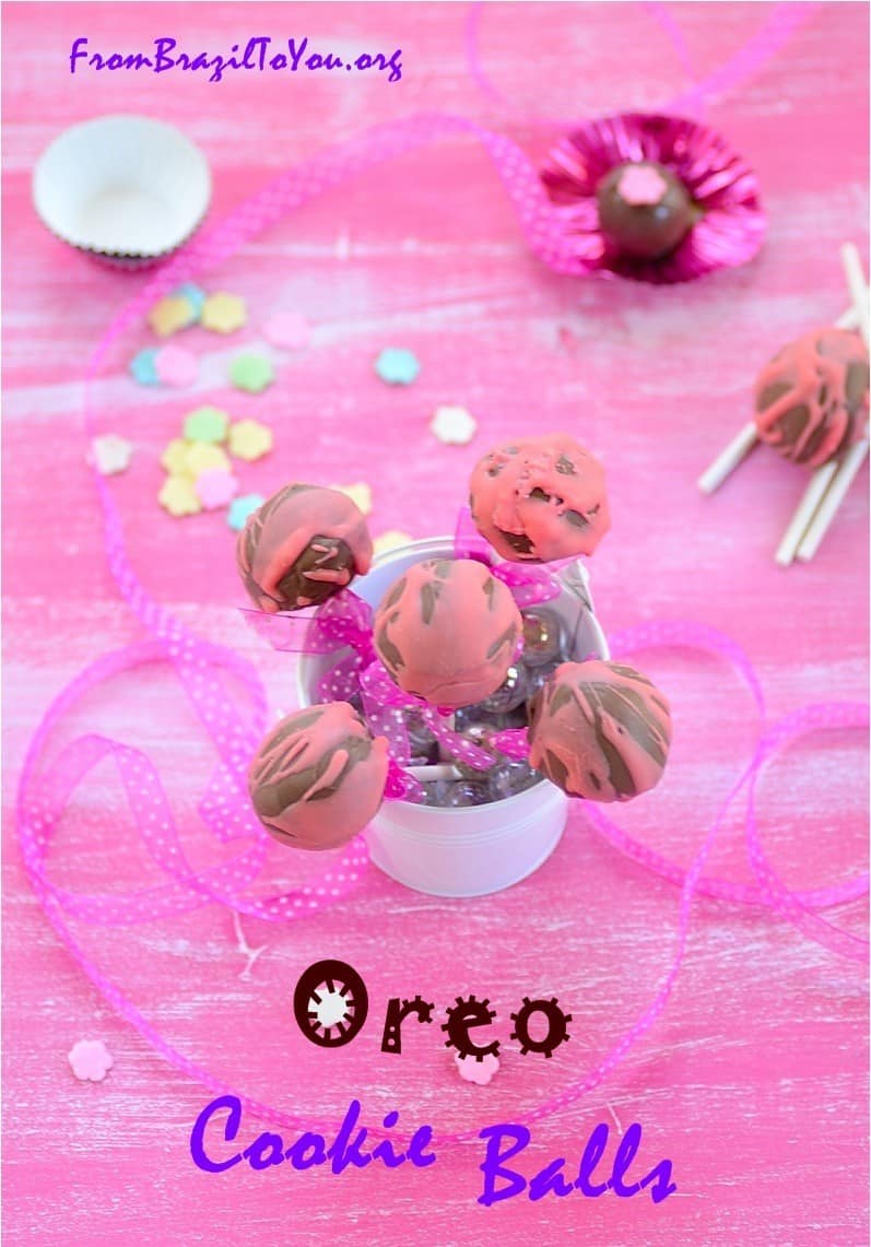 Oreo cookie balls in a jar and others on the top of a table