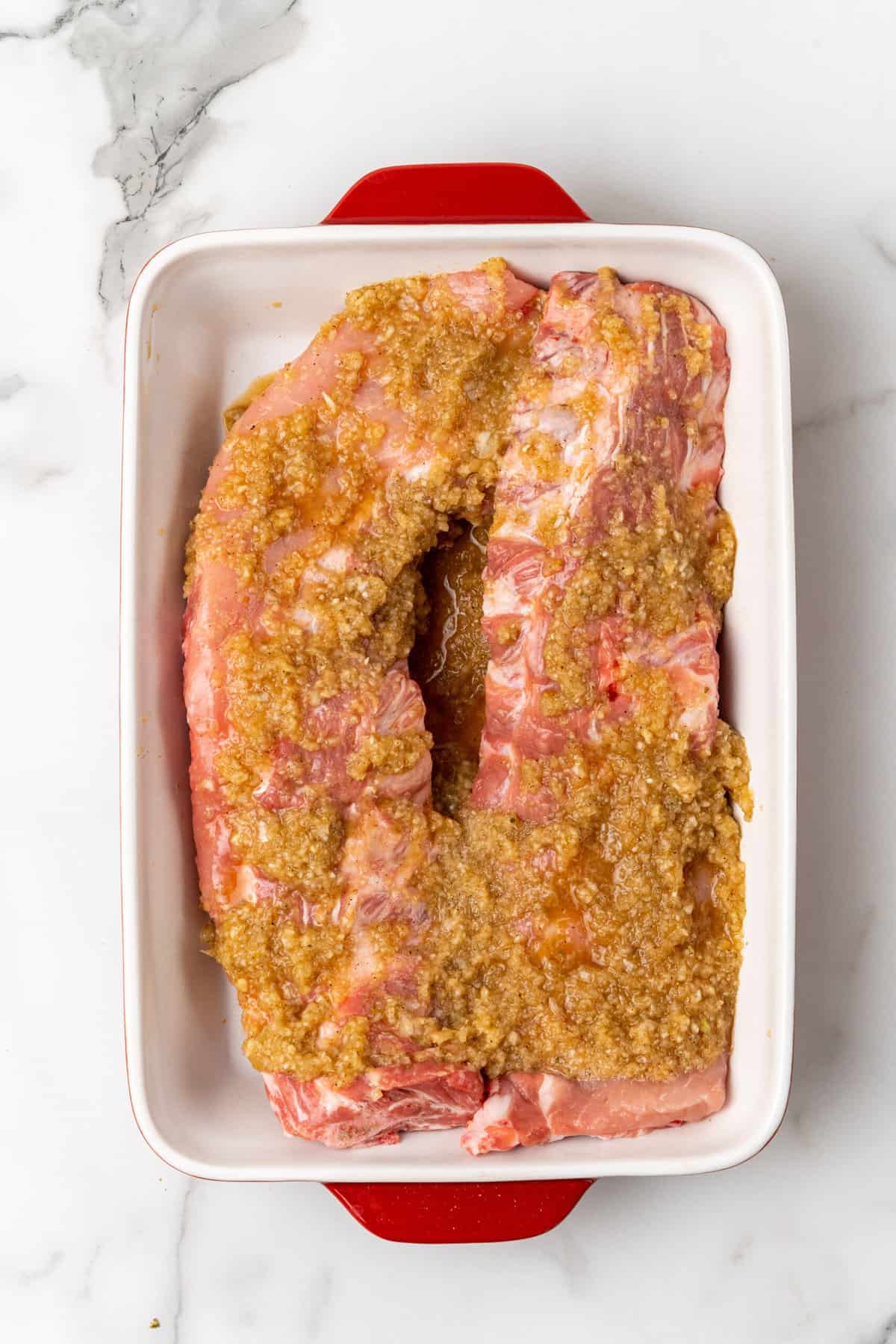 apre pork ribs marinading ina  baking dish.