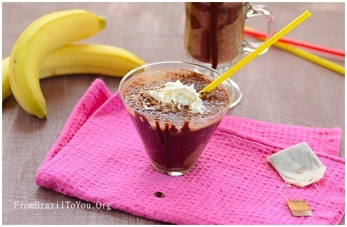 Banana Coffee Chai Smoothie in a glass with bananas on the side