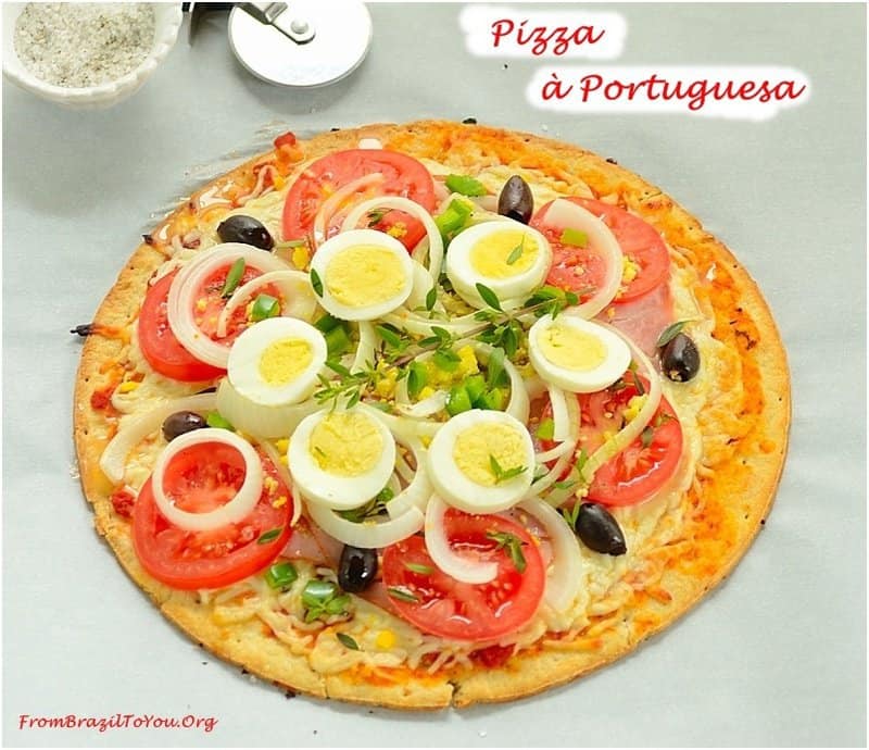 Pizza a Portugesa or Portuguese style pizza with hard boiled eggs and chouriço sausage