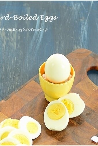 peeled, hard boil eggs on a cutting board