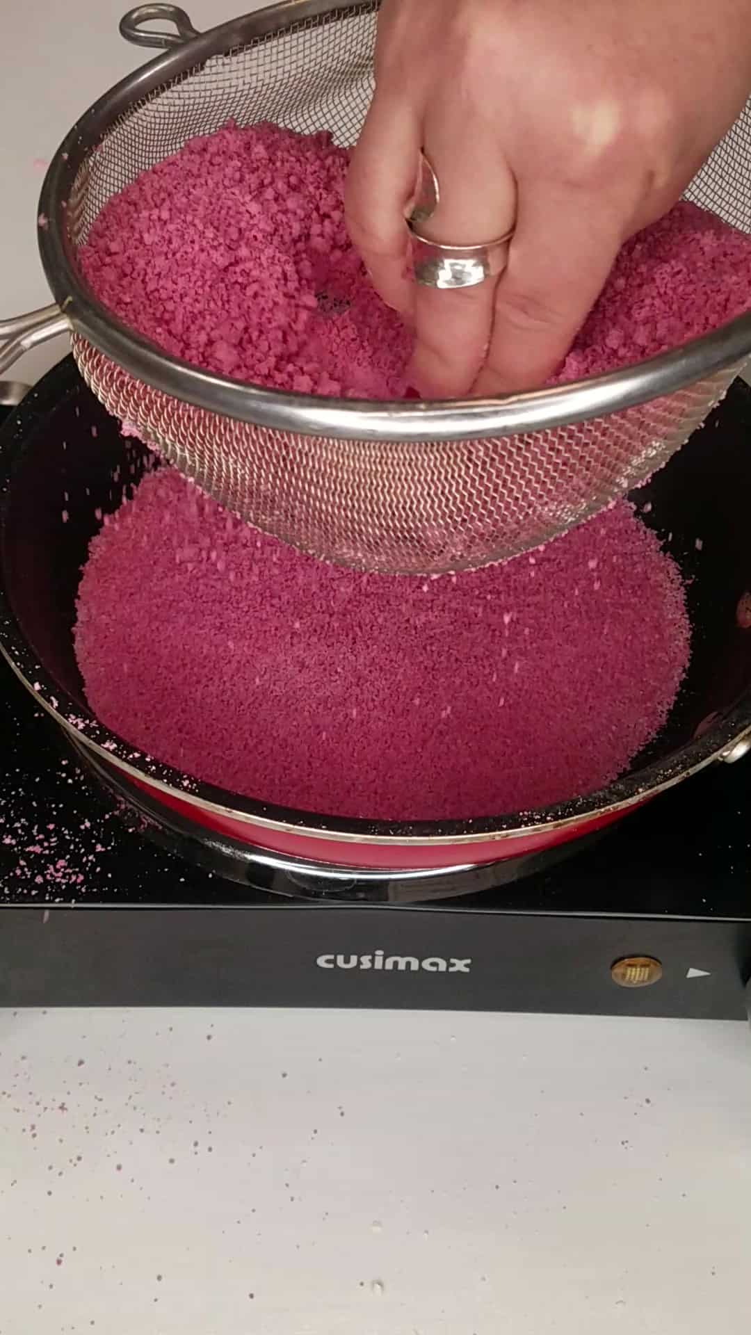 Sieving the tapioca flour mixture onto a hot skillet.