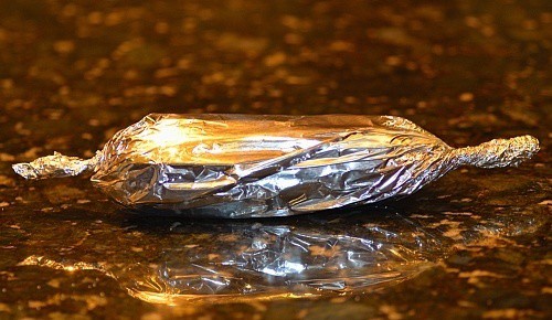 Corn wrapped with aluminum foil