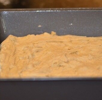 batter spread in a greased baking pan