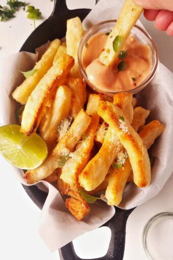 yuca fries dipped in sauce